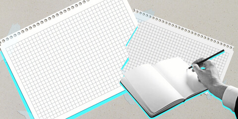 Blank graph papers and a hand writing in notebook on beige background.