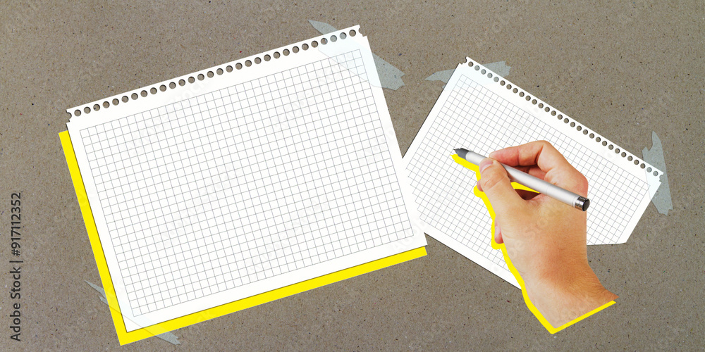 Poster hand writing on graph paper with blank sheet beside, taped to a grey surface.
