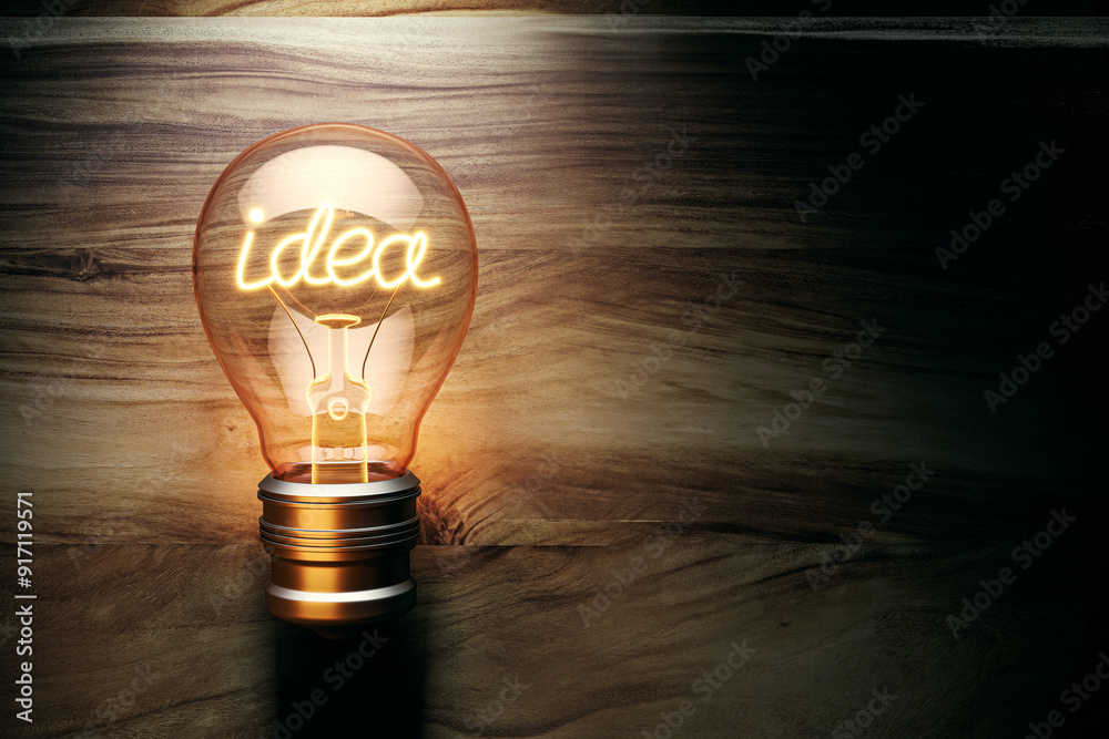 Aufkleber Illuminated lightbulb with the word idea glowing on a wooden background. 3D Rendering