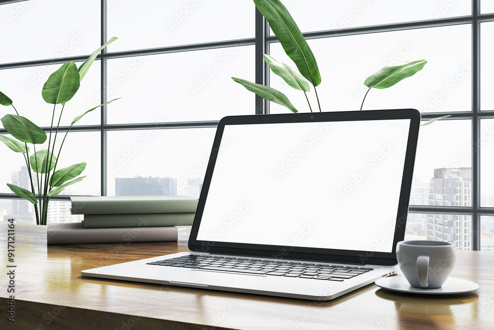 Poster Modern workspace with a laptop on a wooden desk in front of a large window with city view. 3D Rendering