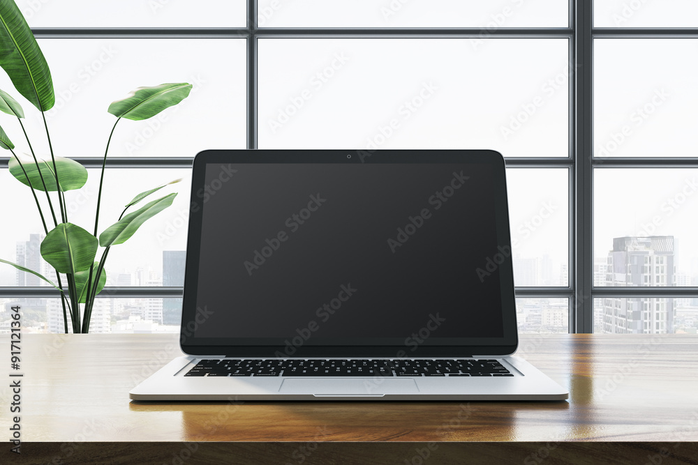 Poster modern laptop on wooden desk in front of large window with city view. 3d rendering