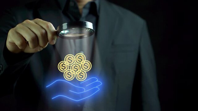 Growth value, increase value, value added. business growth concept. Businessman holding magnifying glass to focus on glowing neon line of earnings icon on virtual screen.