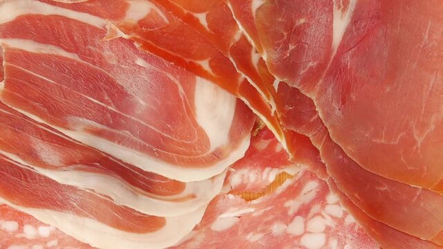 Sliced meat on a board.