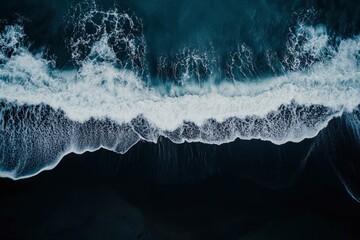 Fototapeta premium aerial top down view of beautiful white blue water waves splashing over dark beach , ai