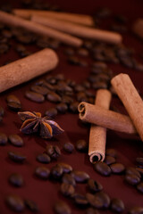 Cinnamon sticks on a background of coffee beans