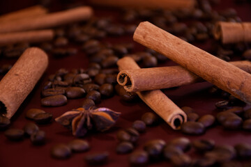 Cinnamon sticks on a background of coffee beans
