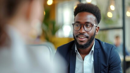 Obraz premium Male candidate confidently answering questions in an interview.
