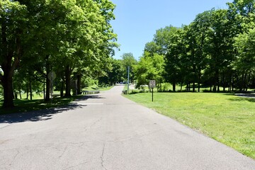 The long empty street in the countryside on a sunny day.