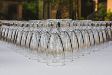 Symmetrical Arrangement of Upside-Down Wine Glasses at Event