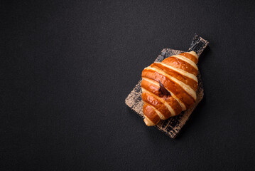 Delicious crispy sweet croissant cornet with chocolate