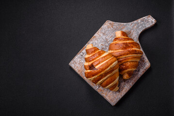 Delicious crispy sweet croissant cornet with chocolate