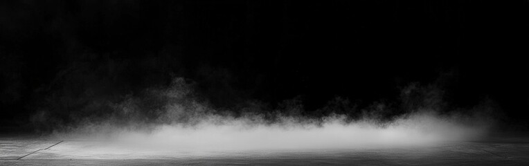 Mist forming on a dark surface in a low-lit environment