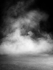 Smoke swirling across a dark background in low light conditions