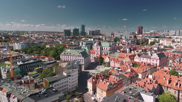 Summer skyline cityscape of Poznan (Poznań), Poland. Wide panoramic view of the Old town: Plac Kolegiacki square and Basilica of Our Lady of Perpetual Help in Poznań Fara (Fara Poznańska)