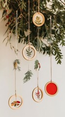 Delicate ornaments featuring natural elements dangle from a festive branch