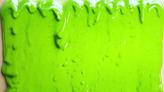 Bright green gooey slime dripping down a wall background texture