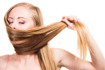 Girl covering her mouth with long hair