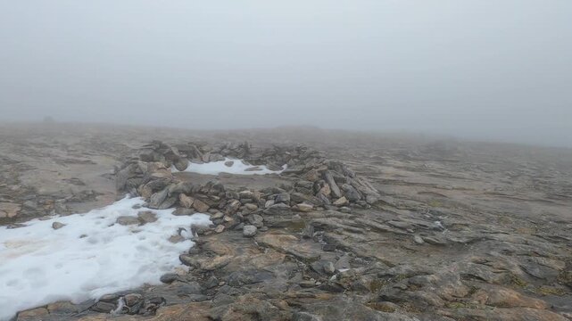 Snowy wind and fog on Maroma peak in thunderstorm day, Sierra Tejeda, Spain 