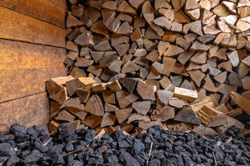 Pile of coal and stored firewood in the boiler room.