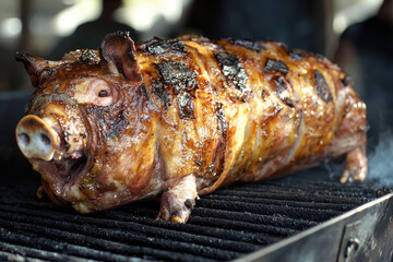 Savor the Rich Flavors of a Peruvian-Style Lech&oacute;n, a Whole Pig Delightfully Roasted Over an Open Fire for a Heartwarming Culinary Experience.