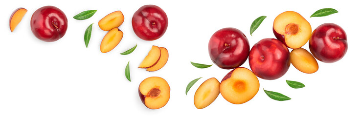 fresh red plum and half with leaves isolated on white background with copy space for your text. Top view. Flat lay