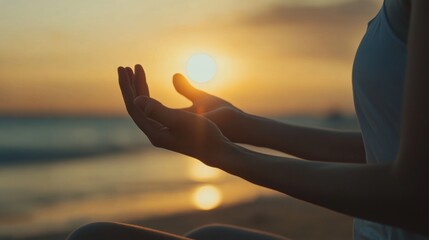 Hands holding the setting sun during meditation. Mindfulness and wellness