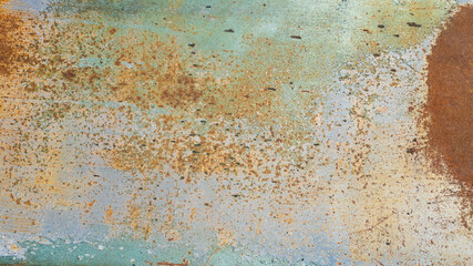 Close-up of rust and peeling paint on a metal surface, symbolizing decay and corrosion issues in...