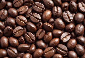 Fototapeta premium Close-up of roasted coffee beans, with their rich brown color and textured surfaces filling the frame