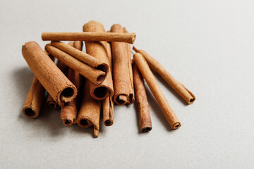 Brown cinnamon sticks on the table.