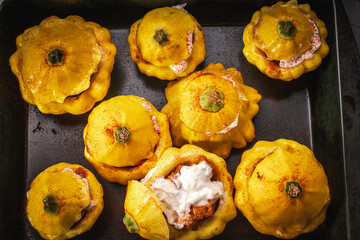 Pumpkins stuffed with turkey and cheese, baked in the oven on the oven.