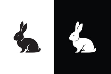 Black side silhouette of a rabbit isolated on white and black background.
