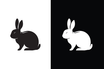 Black side silhouette of a rabbit isolated on white and black background.