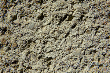 Detailed View of a Textured Plaster Wall, Showcasing Natural Imperfections and Variations in Color and Pattern