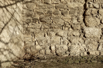 Ancient Stone Wall Made of Boulders With Textured Surface in a Natural Setting During Daylight