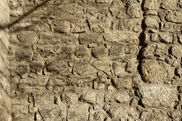 Ancient Stone Wall Texture Featuring Boulders in a Weathered Structure Under Natural Light