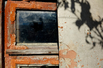 Old Painted Wooden Window With Glass and Textured Background in a Rustic House During the Daytime