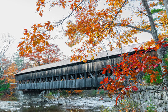 Albany Bridge over the river Swift near North Conway NH with fall trees and leaves