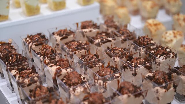Candy bar, Sweets on stands. Delicious desserts at the banquet, sponge cakes, shortbread tarts. move camera footage. Close up