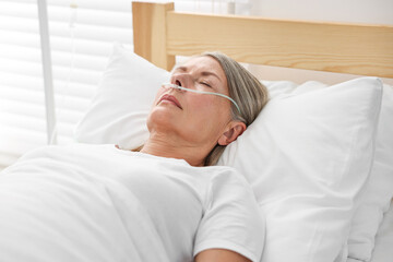 Coma patient. Mature woman sleeping in hospital bed