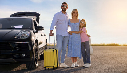 Naklejka premium Happy family near car on road trip. Banner design with space for text