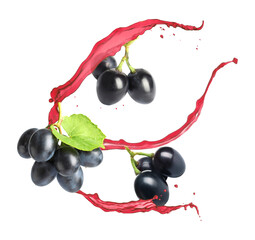 Juice splashes and fresh grapes in air on white background