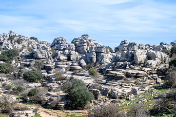 Hiking in the Torcal de Antequerra National Park, limestone rock formations and known for unusual karst landforms in Andalusia, Malaga, Spain.