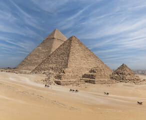 The great pyramids of Giza in Egypt with blue sky.