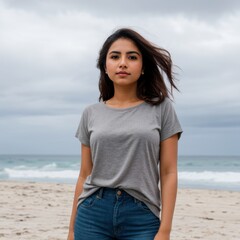 Confident Woman on Beach with Gentle Waves and Gray Skies 
