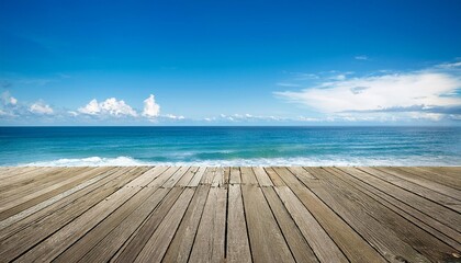 Obraz premium A wooden deck with a view of the ocean