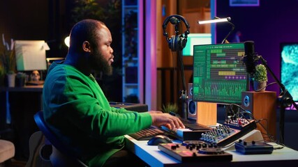 Artist playing electronic piano keyboard notes and recording audio files to use mix and master techniques, editing recordings to edit sound effects. Musician operating on synthesizer gear. Camera A.