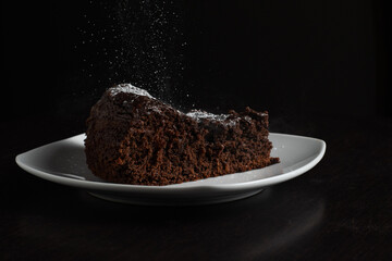 Slice of Chocolate Cake with Powdered Sugar