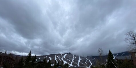 Gray Clouds Over Ski Sloped Mountains