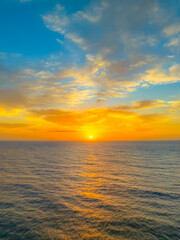 Aerial views of sunrise by the sea with clouds