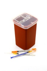 Sharps container for bio-hazard hypodermic needles